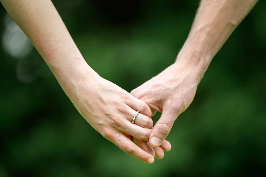 A couple holding hands