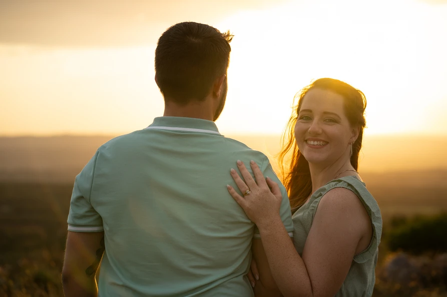 Couple laughing together at sunset